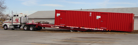 Pierce Leasing Blast resistant module being unloading by a truck.